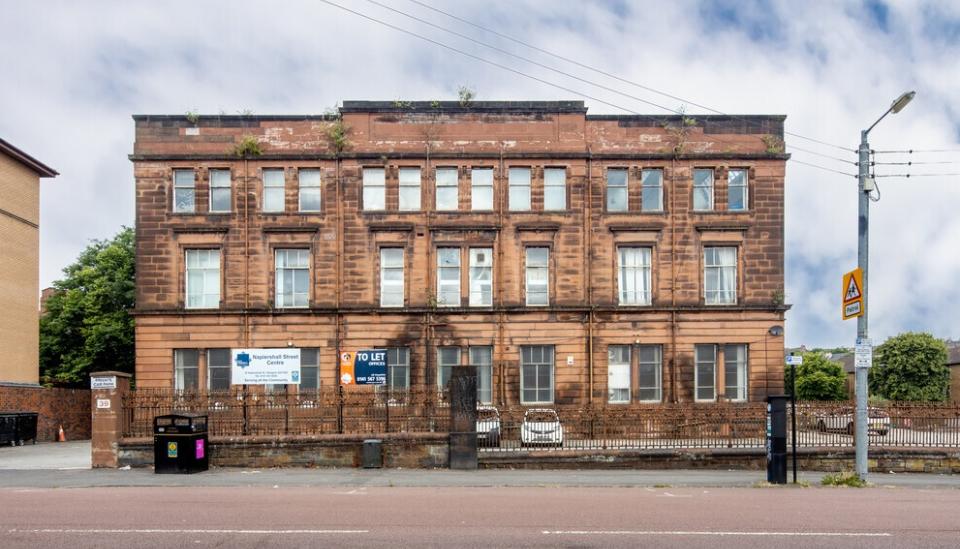 3 storey red sandstone building